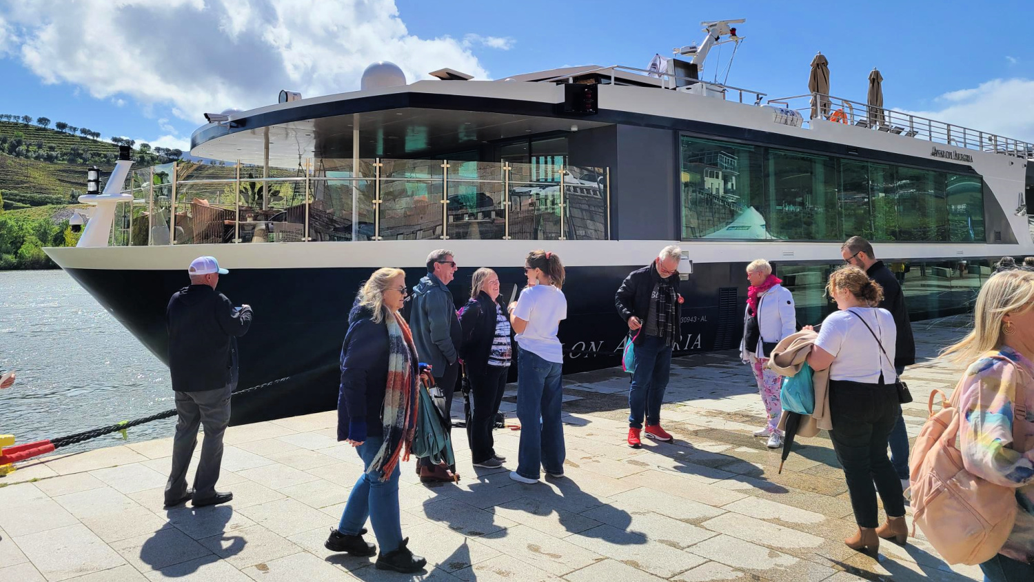 Passengers beside a river cruise ship, one of the easier trips to find with no single supplement.